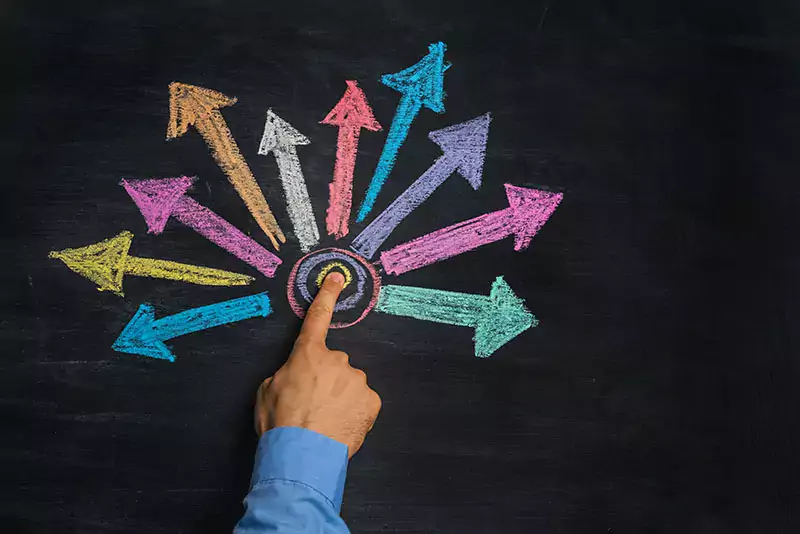 multicolored arrows drawn on blackboard